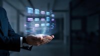 Businessman holding holographic digital interface with glowing data panels and futuristic technology display in modern office environment.