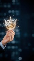Hand holding glowing golden lotus flower with sparkling light particles against dark blue bokeh background. Represents growth, success, innovation, and spiritual transformation for business concepts.