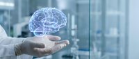 Digital brain hologram floating above medical professional hand in modern healthcare facility representing artificial intelligence and neuroscience innovation.