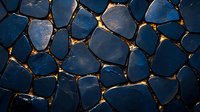 Dark blue stone mosaic pattern with golden light glowing through irregular cracks, creating dramatic contrast and organic geometric shapes. Suitable for luxury design backgrounds.
