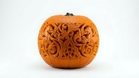 Intricately carved pumpkin with ornate swirl patterns and decorative motifs on white background, isolated for autumn holiday design projects.