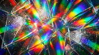 Colorful light rays and prisms create a vibrant, abstract explosion of rainbow spectrum colors with sparkling particles, perfect for backgrounds and digital design projects.