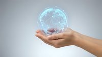 Hand holding glowing digital globe with connected network lines, representing global communication, technology, data connectivity, and worldwide business innovation.