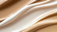Smooth flowing liquid foundation makeup texture with creamy beige waves creating elegant cosmetic background for beauty and skincare applications.