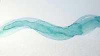 Turquoise watercolor wave flowing across white textured paper creating organic fluid movement for artistic projects and creative designs.