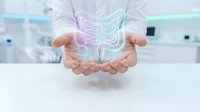 Healthcare professional displaying holographic digestive system model in modern medical facility for patient education and treatment planning.