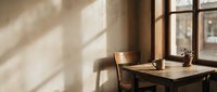 Cozy wooden desk workspace by window with warm natural sunlight streaming across minimalist home office interior creating peaceful productive atmosphere.