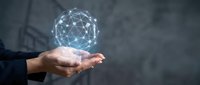 Businessman holding glowing digital network sphere with connected nodes representing global connectivity, technology innovation and data communication solutions.