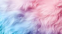 Soft pastel fur texture with gradient colors from blue to purple and pink, creating dreamy fluffy background for fashion or cosmetic designs.