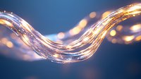 Glowing wave of light with sparkling particles flowing in curved motion against dark blue background, creating magical luminous effect for abstract designs.