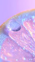 Sparkling water drop on iridescent holographic surface with bokeh lights and dreamy pink and purple gradient background creates magical macro photography effect.