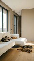 Modern minimalist living room interior with multiple cats relaxing on white sectional sofa and hardwood floor near large windows for home decor.