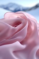 Soft pink rose petals in extreme macro view showing delicate curves and textures against blurred blue background, creating romantic and gentle atmosphere for wedding designs.