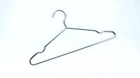 Chrome metal wire clothes hanger isolated on white background, minimalist wardrobe accessory for clothing storage and organization.