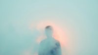 Silhouette of adult male figure emerging from soft pastel mist, ethereal atmospheric effect with turquoise and pink tones, suitable for wellness, meditation, and spiritual content.