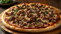 Homemade pizza with spicy Italian sausage, melted mozzarella and fresh herbs on wooden cutting board, crispy golden crust and savory tomato sauce.