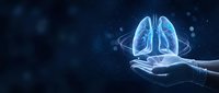Human hands holding glowing blue lungs hologram with digital particles on dark background for medical healthcare technology concepts.