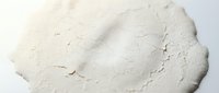 Close-up of white cream or paste texture with visible brush strokes and organic surface variations, suitable for cosmetics, skincare, food, or art material backgrounds.