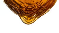 Amber liquid with ripples and bubbles isolated on white background, suitable for cosmetics, skincare, wellness and beverage product design.