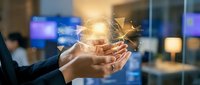 Business professional hands holding glowing digital network connections with light effects in modern office environment for technology presentations.