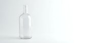 Empty clear glass bottle on white background isolated for product mockup and packaging design projects.