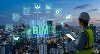 Construction engineer using BIM technology with digital icons over modern city skyline at dusk for smart building management and urban planning projects.