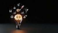 Glowing lightbulb with brain filament surrounded by floating business icons on dark background representing innovation and creative thinking solutions.