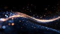 Glowing wave of golden light particles flowing on dark background with sparkling blue bokeh effect creates magical atmosphere for festive designs.
