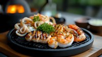 Grilled jumbo shrimp and calamari rings garnished with fresh parsley served on black cast iron plate, selective focus on seafood with blurred background.
