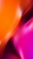 Vibrant gradient background with flowing orange, pink, and magenta waves creating dynamic light effects. Suitable for modern design projects and digital applications.