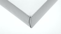 Gray fitted bed sheet corner with elastic band on white mattress showing bedding textile detail for home decor and bedroom interior design.