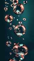Floating soap bubbles with iridescent reflections against dark teal background creating dreamy atmospheric effect for creative projects and designs.