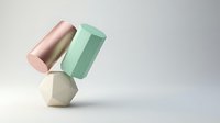 Stacked geometric shapes in pastel tones including cylinder, rectangular prism and hexagonal form balanced on neutral background for modern design projects.