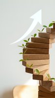 Wooden blocks stacked with green plants growing between them and upward arrow showing sustainable business growth and development concept.