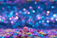 Colorful cereal rings with sugar sprinkles against blurred bokeh lights background in blue and pink tones creating magical breakfast composition.