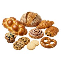 Assorted fresh baked goods including croissants, bread, pastries, muffins, cookies and pretzels isolated on white background for bakery, food and culinary design projects.