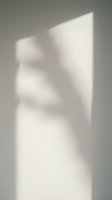 Abstract white plaster torso sculpture with soft shadows and minimalist aesthetic, suitable for contemporary art, interior design, and modern gallery displays.