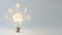 Glowing light bulb with medical healthcare icons floating around representing innovation in medicine and health technology solutions.