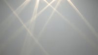 Dramatic stage lighting with crossed beams creating atmospheric rays through haze and fog for concert venue or theater performance backdrop.