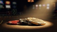 Casino poker chips stacked on a dark gaming table under dramatic spotlight, with blurred slot machines in the background.