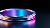 Macro shot of camera lens filter with vibrant neon lighting creating colorful reflections and gradients on metallic surface against dark background. Professional photography equipment.