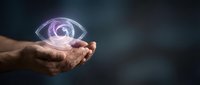 Hands holding glowing eye symbol with purple light effect, representing vision, insight, awareness, and spiritual consciousness for business and technology concepts.