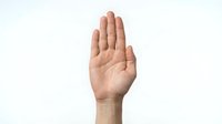 Male hand raised in stop gesture on white background isolated for design projects and presentations.