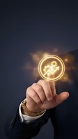 Businessman hand touching glowing golden circle icon with gear and person symbol, representing automation, workflow optimization, and digital technology solutions for enterprise management.