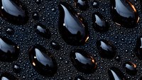 Shiny black water drops on dark surface with golden light reflection creating dramatic contrast pattern, macro photography for luxury cosmetic advertising.