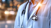 Medical professional in white coat with stethoscope against blurred bokeh background, warm sunlight creating lens flare effect, healthcare concept for hospital or clinic.