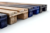Wooden and blue blocks arranged in a minimalist composition on white background, creating depth with selective focus and geometric shapes. Suitable for business concepts.
