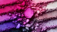 Vibrant crushed makeup pigments in gradient purple and pink tones creating abstract texture pattern on white background, cosmetic powder swatches for beauty industry.