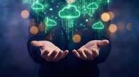 Businessman hands presenting digital cloud computing technology with glowing green data streams and network connections for modern business solutions.