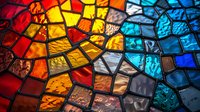 Vibrant stained glass mosaic pattern with red, yellow, and blue fragments creating abstract geometric shapes, illuminated from behind for decorative art.